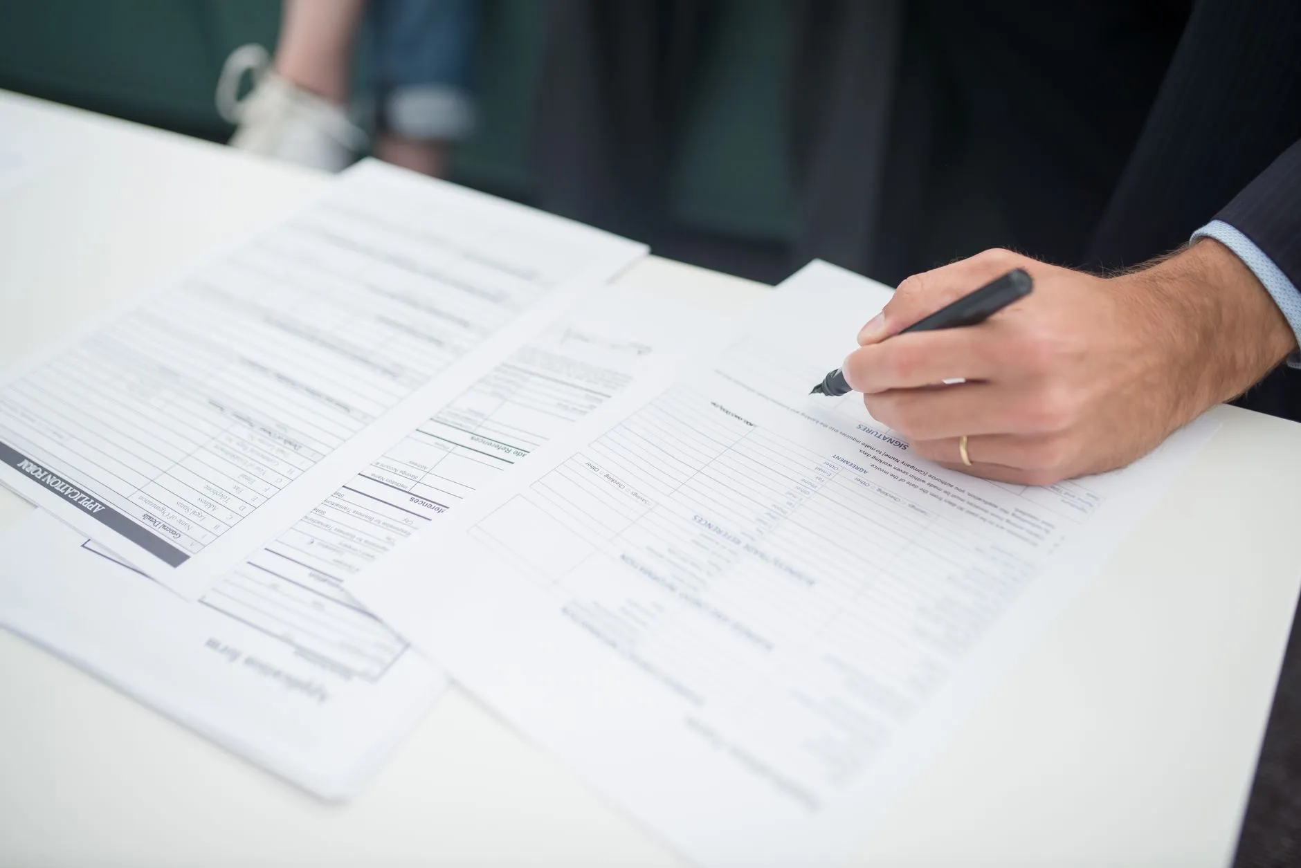 Office workers reviewing a policy document together — Avaib
