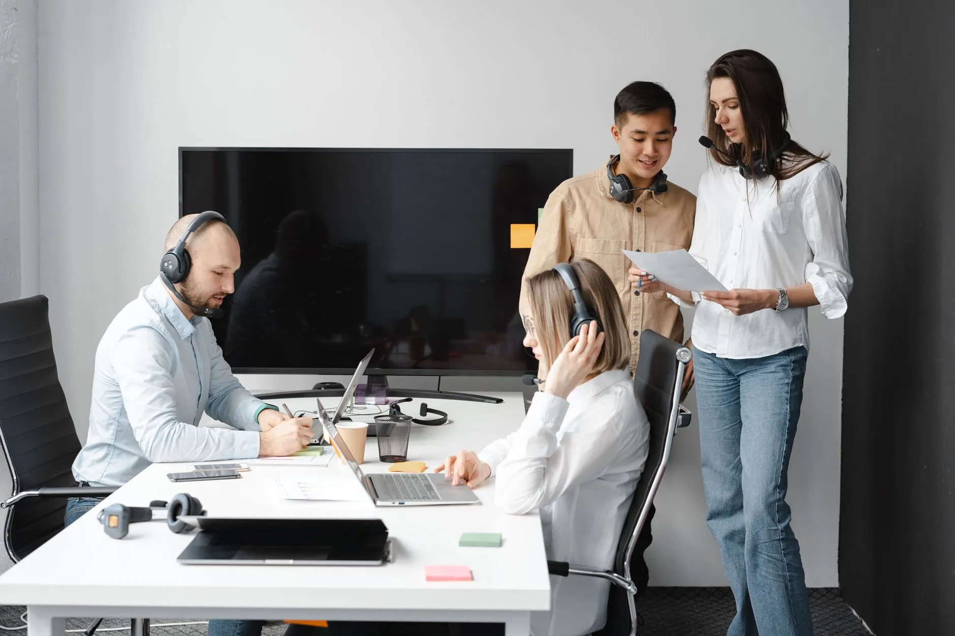 An operations team using an internal business application on multiple screens — Avaib