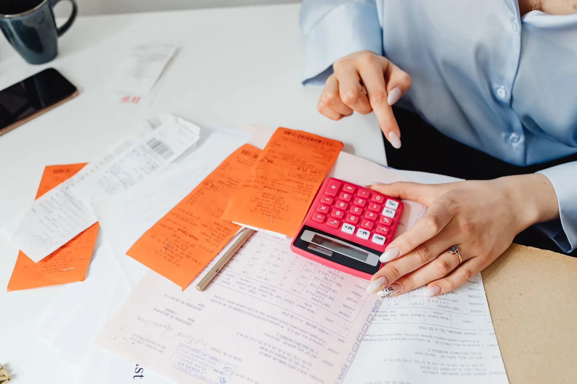 A business owner reviewing job costing and financial reports on a computer — Avaib