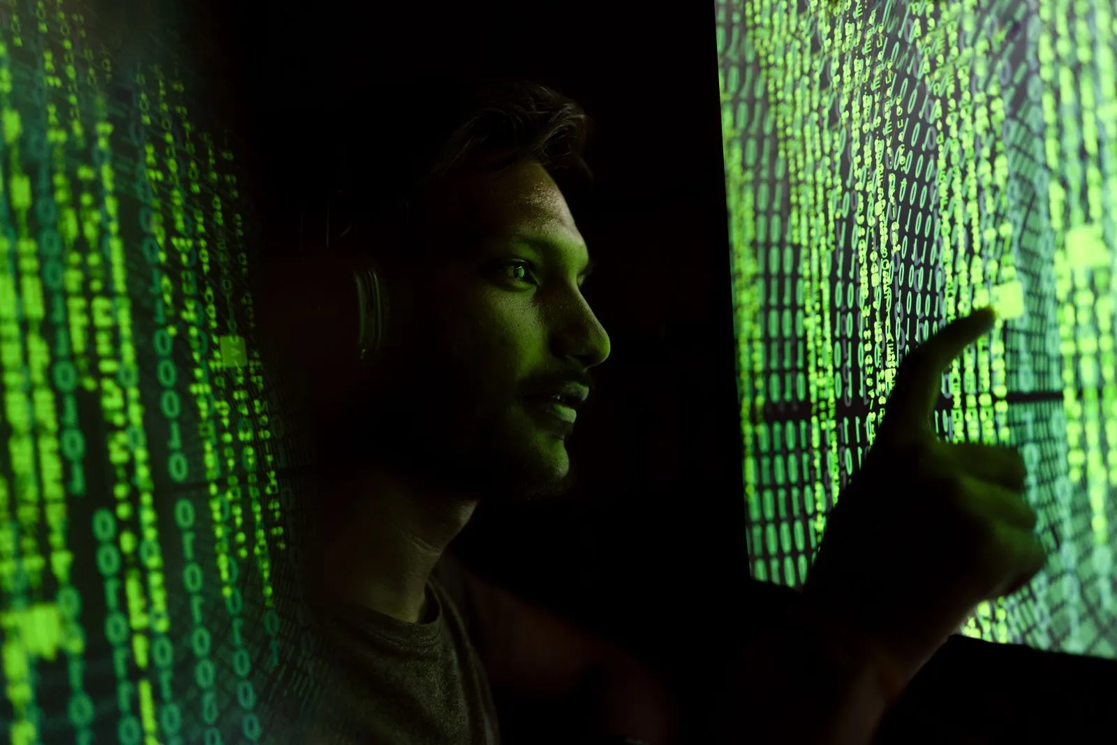 A security and governance professional working at a computer — Avaib