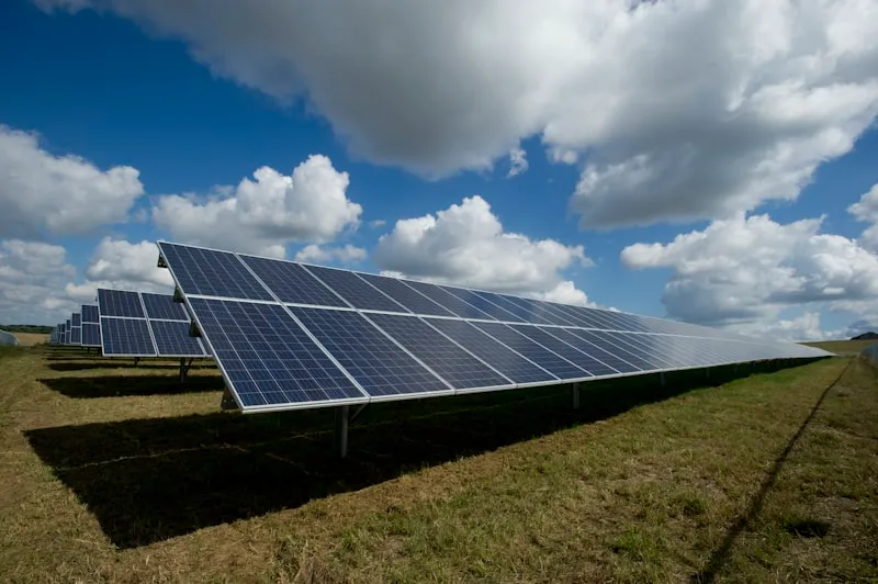 A solar-panel field powering a renewable-energy ERP platform