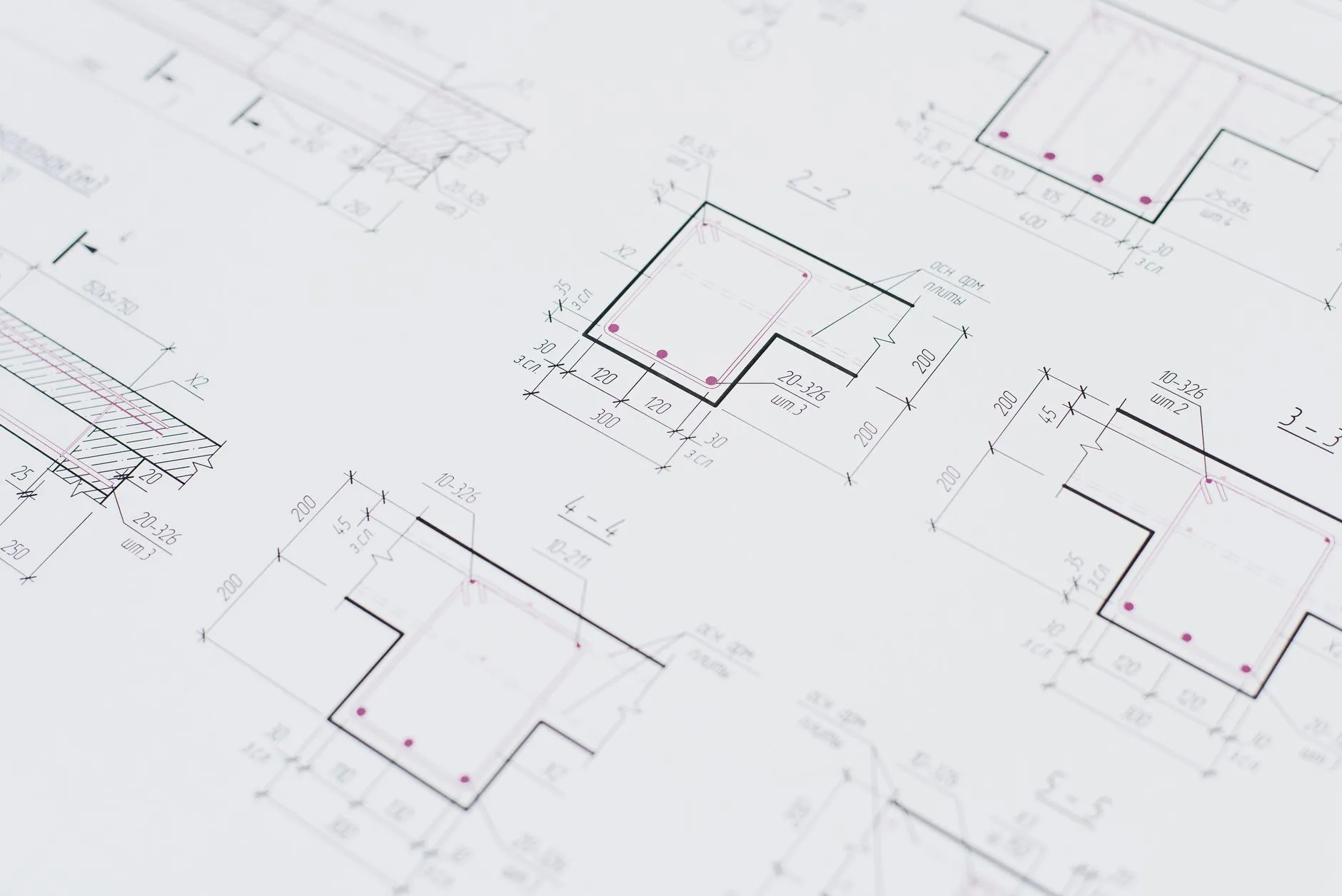 An engineer working on a microservices architecture with multiple screens — Avaib