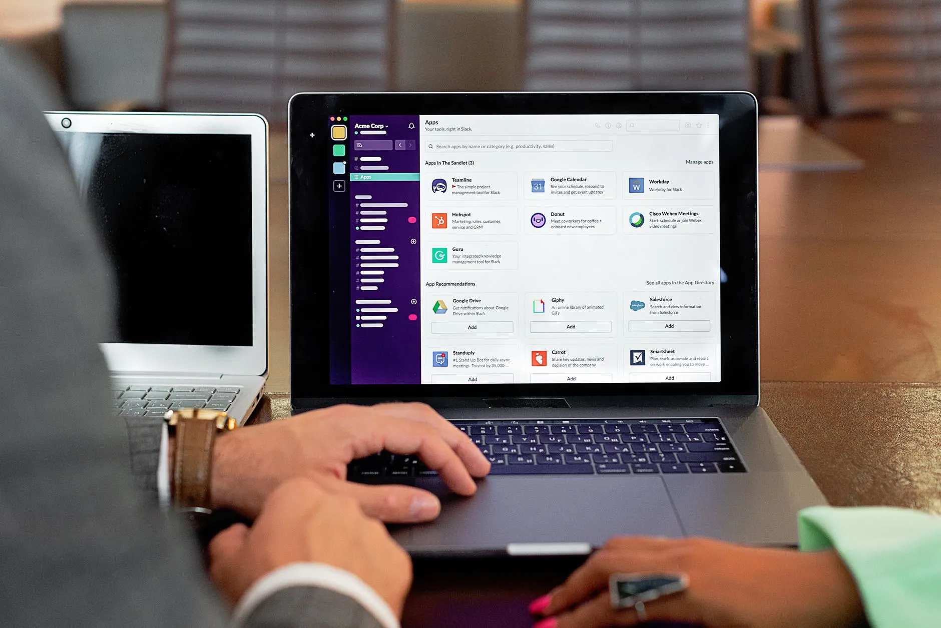 A team using internal business software on a laptop in an office — Avaib