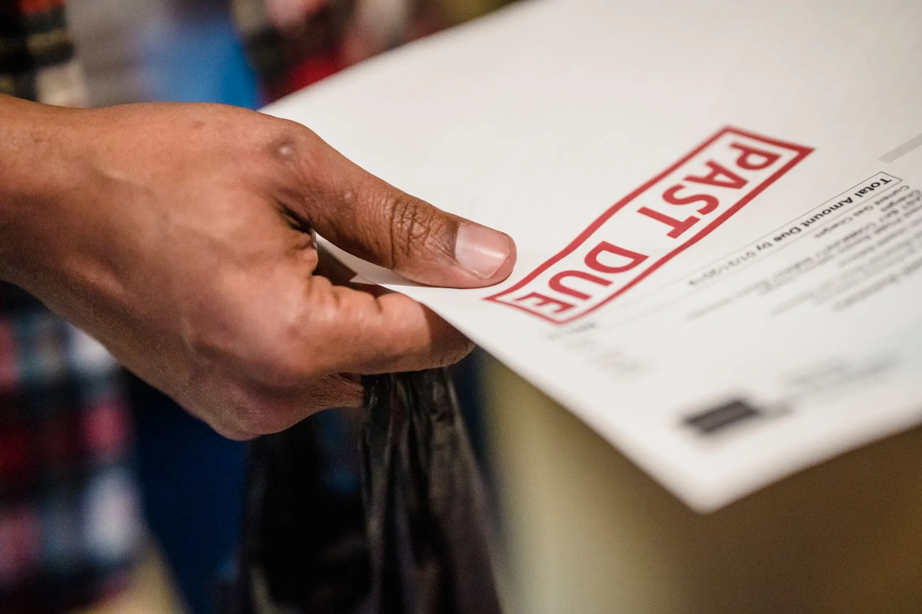 A person reviewing a subscription billing statement on a laptop — Avaib
