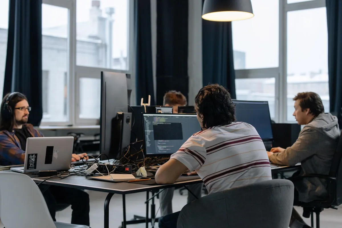 A Karachi software house team collaborating at their desks