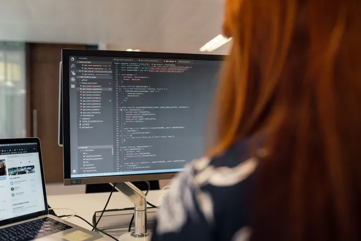 An engineer building a cloud-native application on screen — Avaib