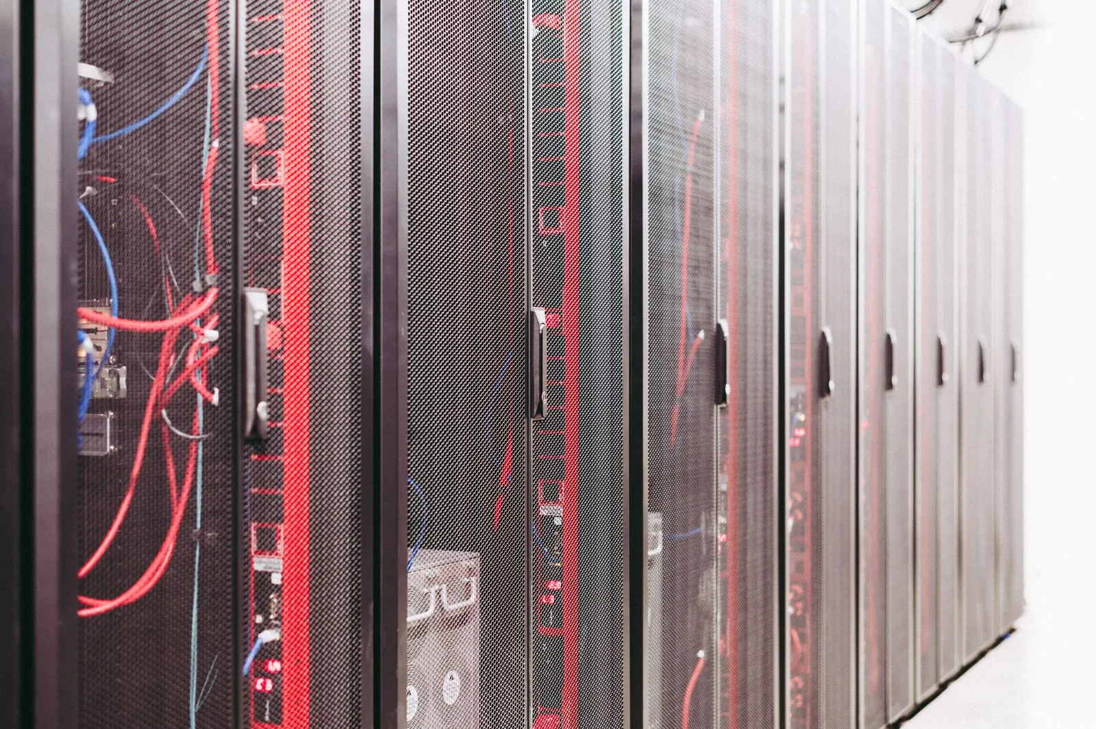 Rows of server racks in a modern data center — Avaib