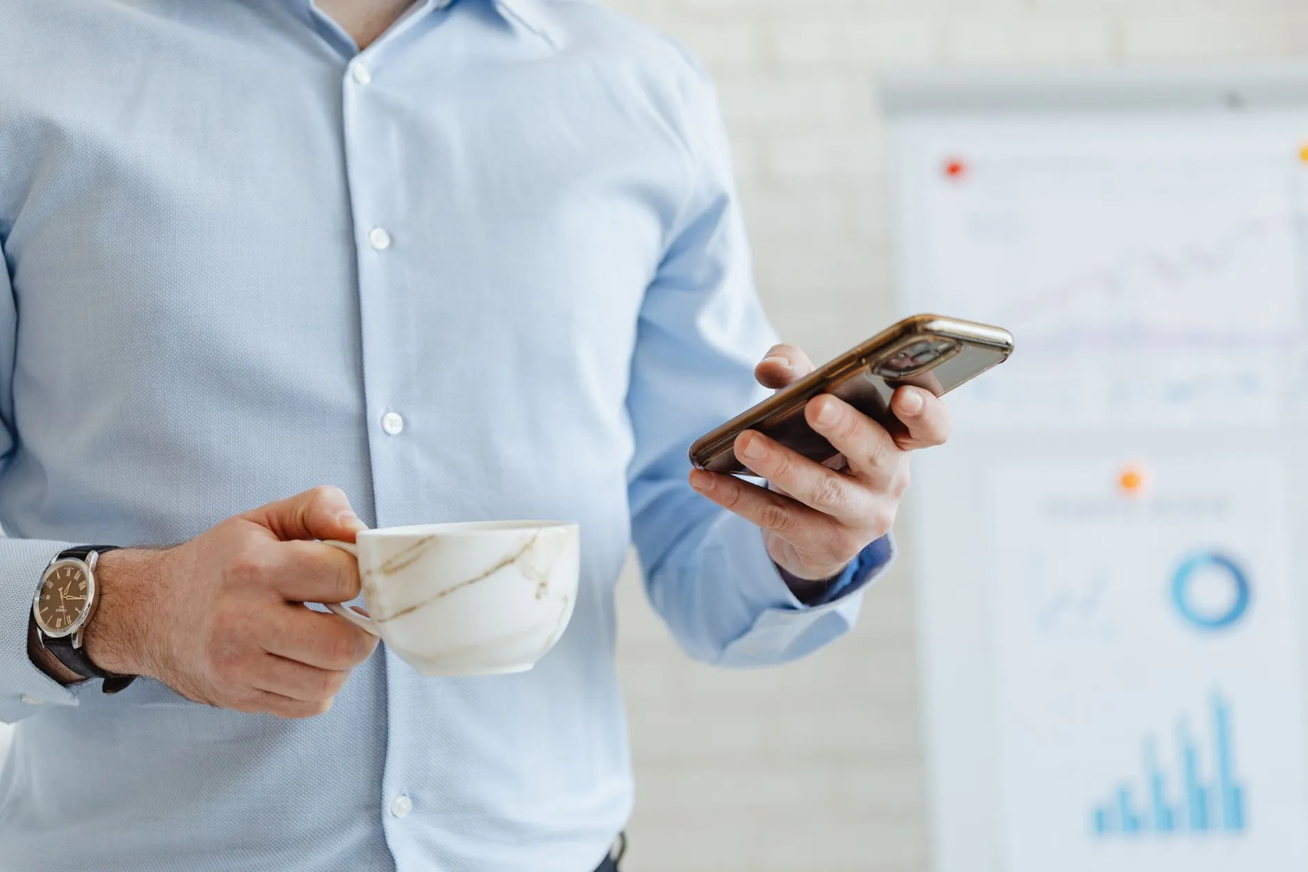 An employee using a secure internal business app on a smartphone in an office — Avaib
