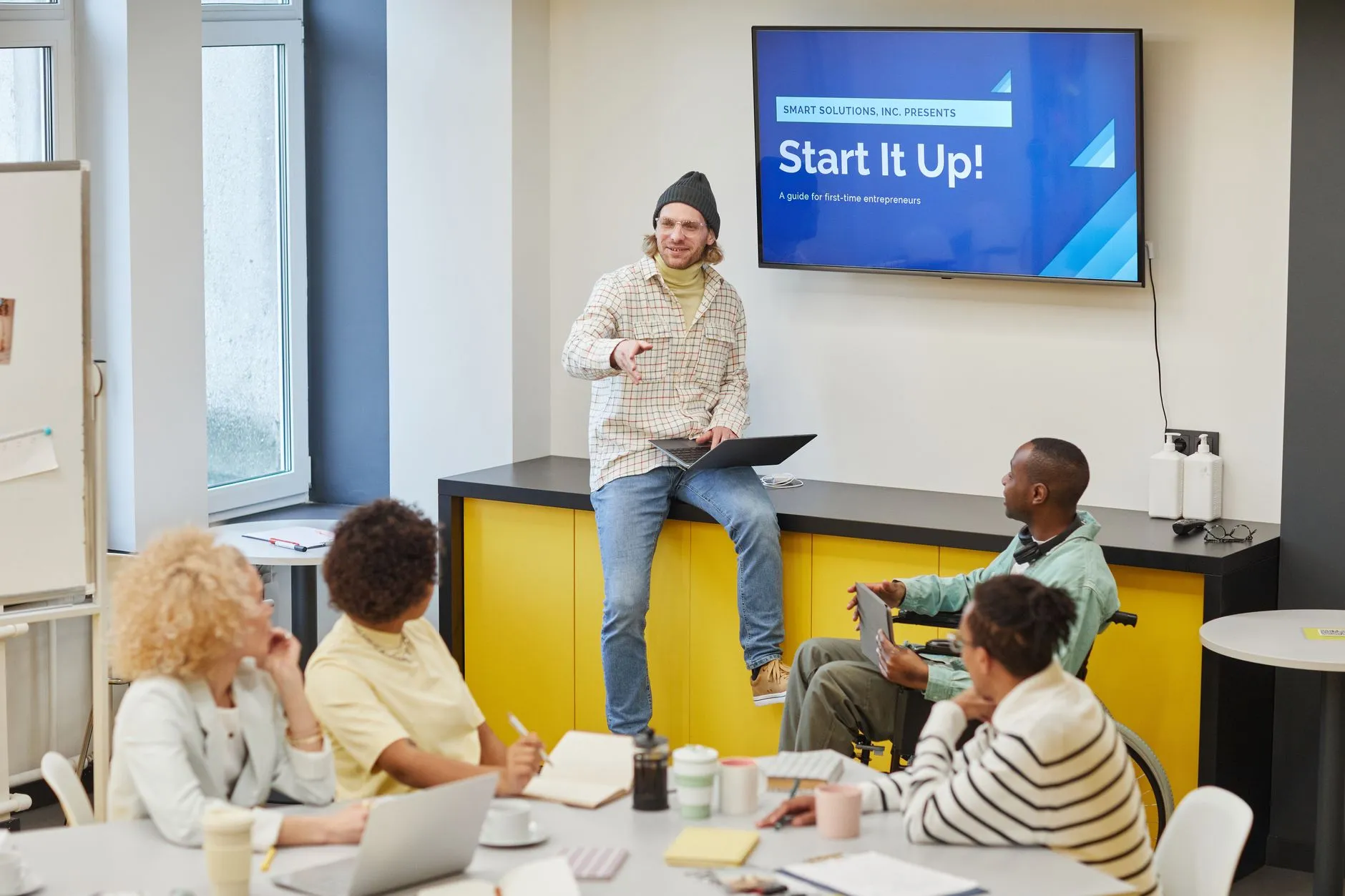 A startup team launching a SaaS product on a laptop with subscription management — Avaib