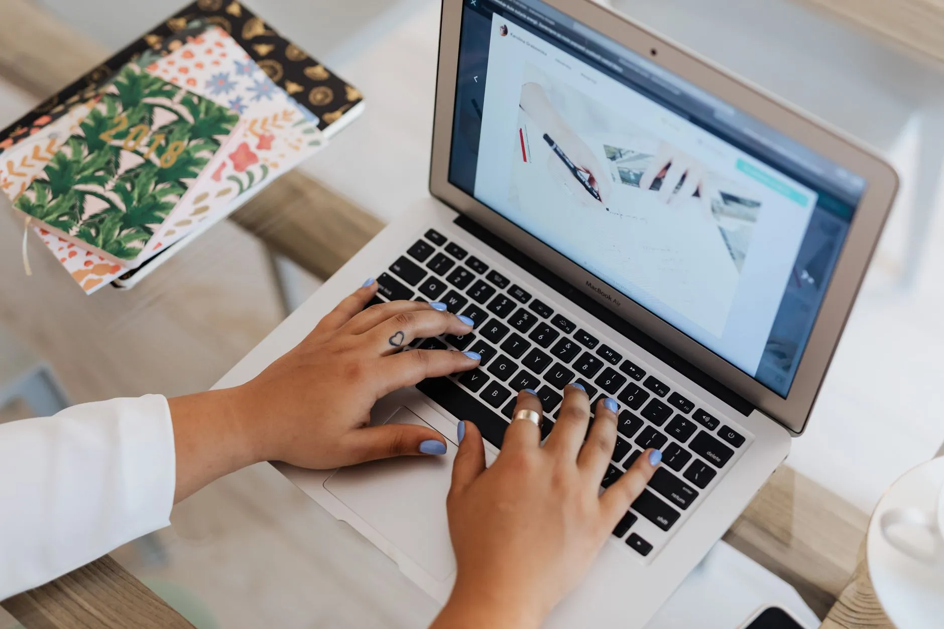 A content editor updating a website through a custom CMS on a computer — Avaib