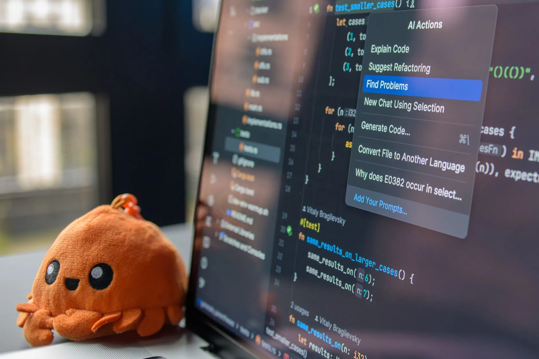 A software engineer reviewing and refactoring legacy PHP code on a monitor — Avaib