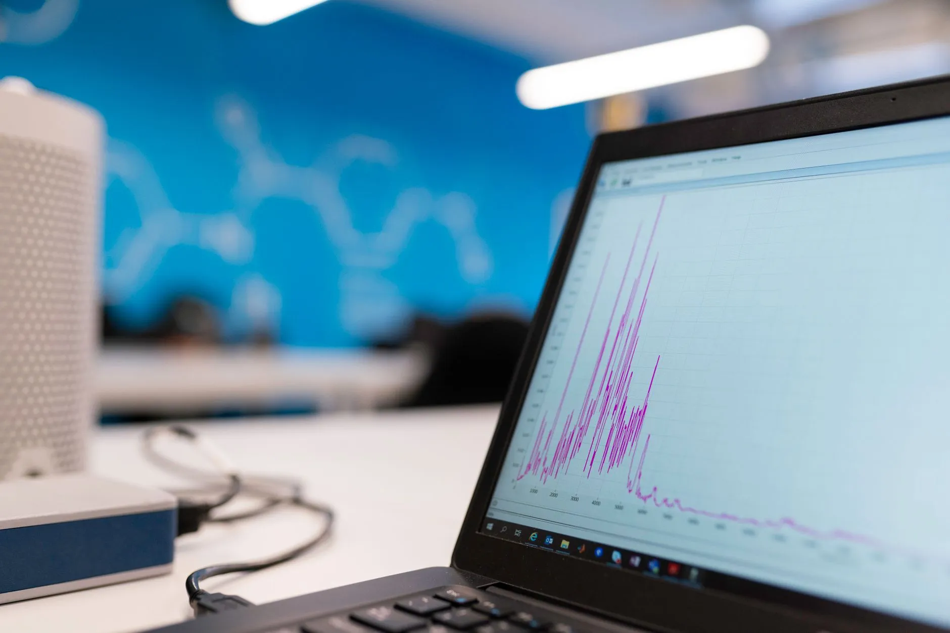 An engineer analysing usage analytics and metering data on a monitor — Avaib