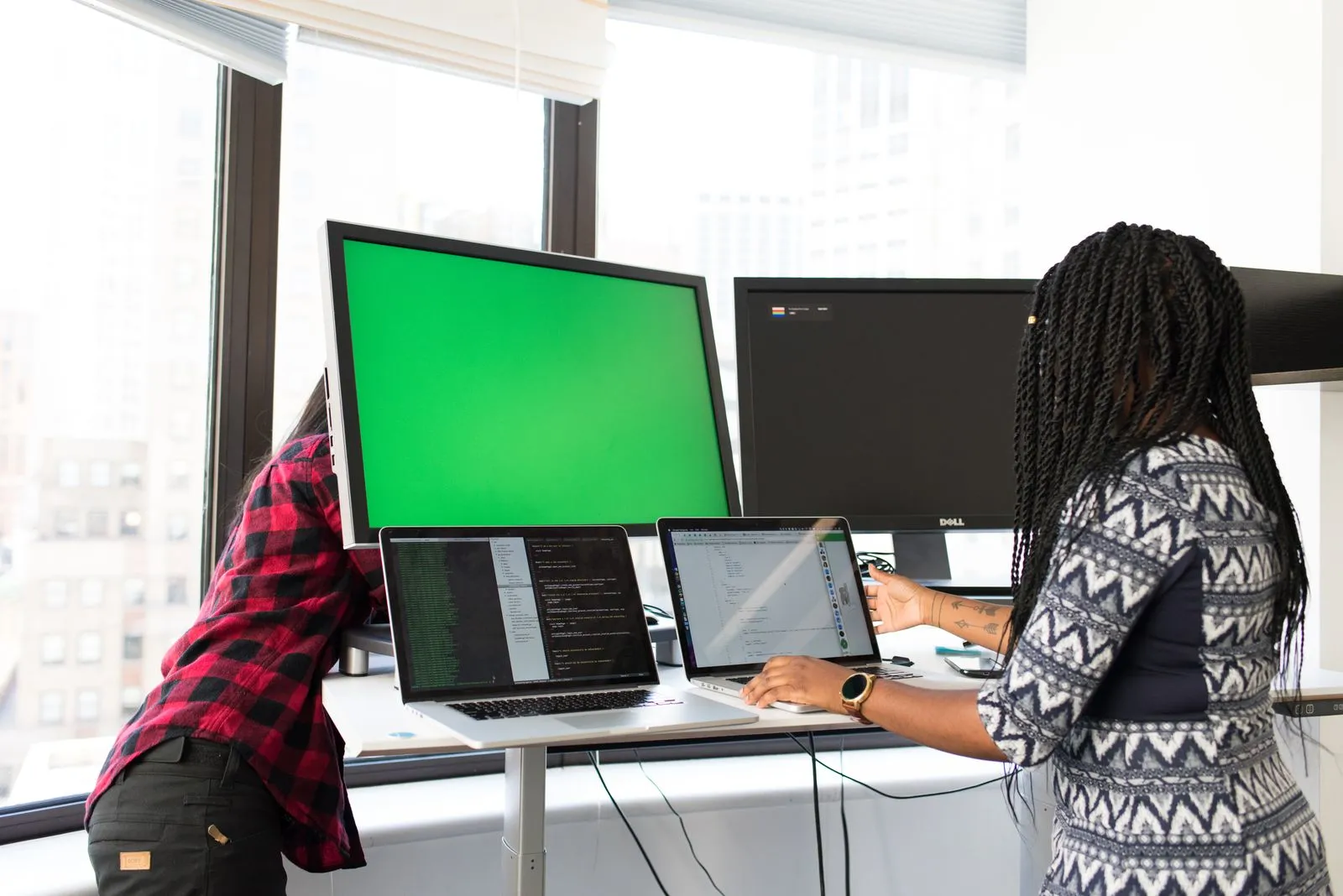 Two senior software engineers building a product together at one screen — Avaib