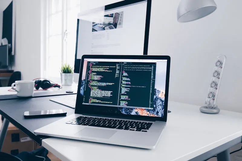 A team building a web application together on a laptop