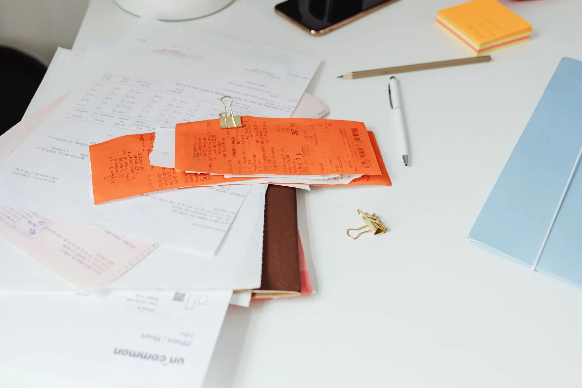An invoice document being scanned and processed on a desk — Avaib